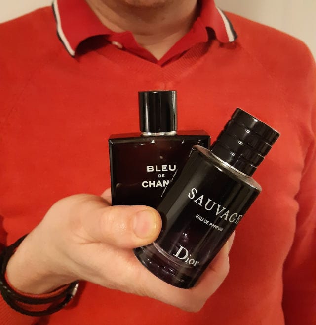 andrew holding sauvage and bleu de chanel
